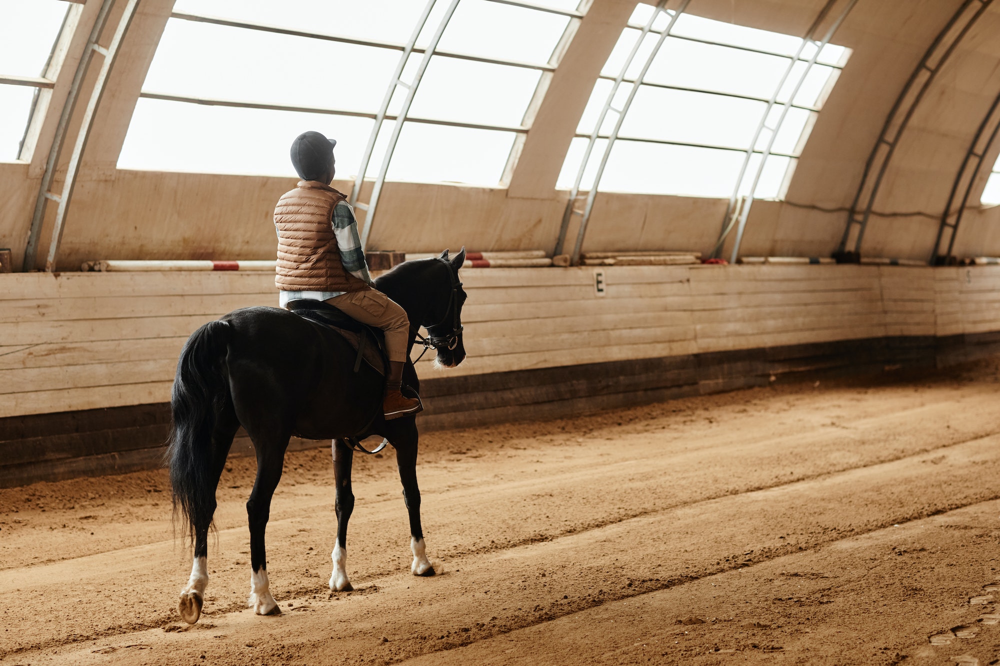 Woman Riding Horse Indoors